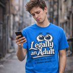 Man wearing a blue t-shirt with 'Legally an Adult' text, standing on a street.